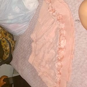 Short pink skirt for a girl